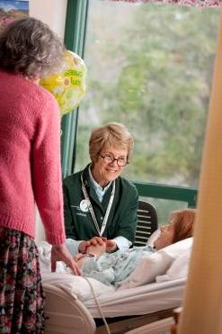 A palliative care volunteer with a patient